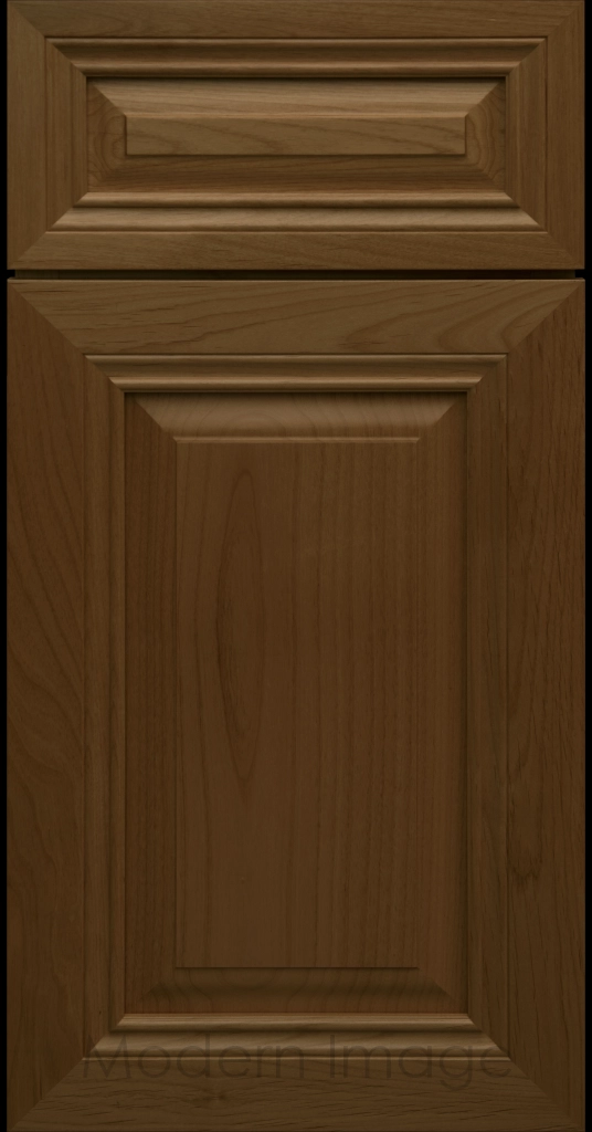 Close-up of a Cognac-stained wood cabinet door with a mitered frame and traditional Cambridge raised center panel.